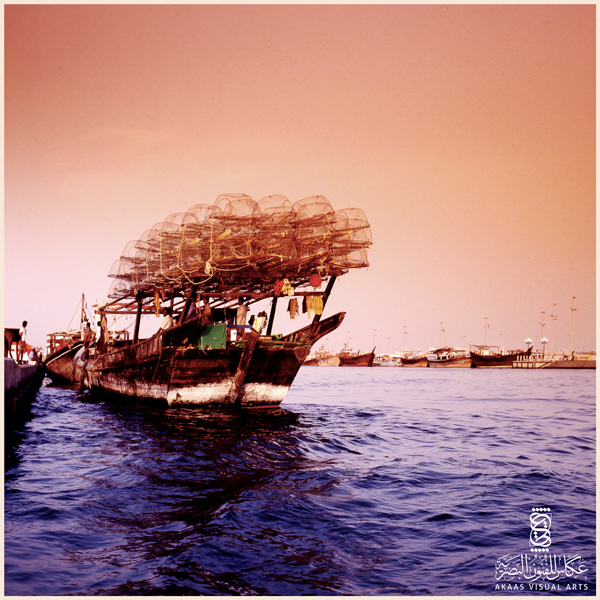 A wooden traditional fishing boat docking